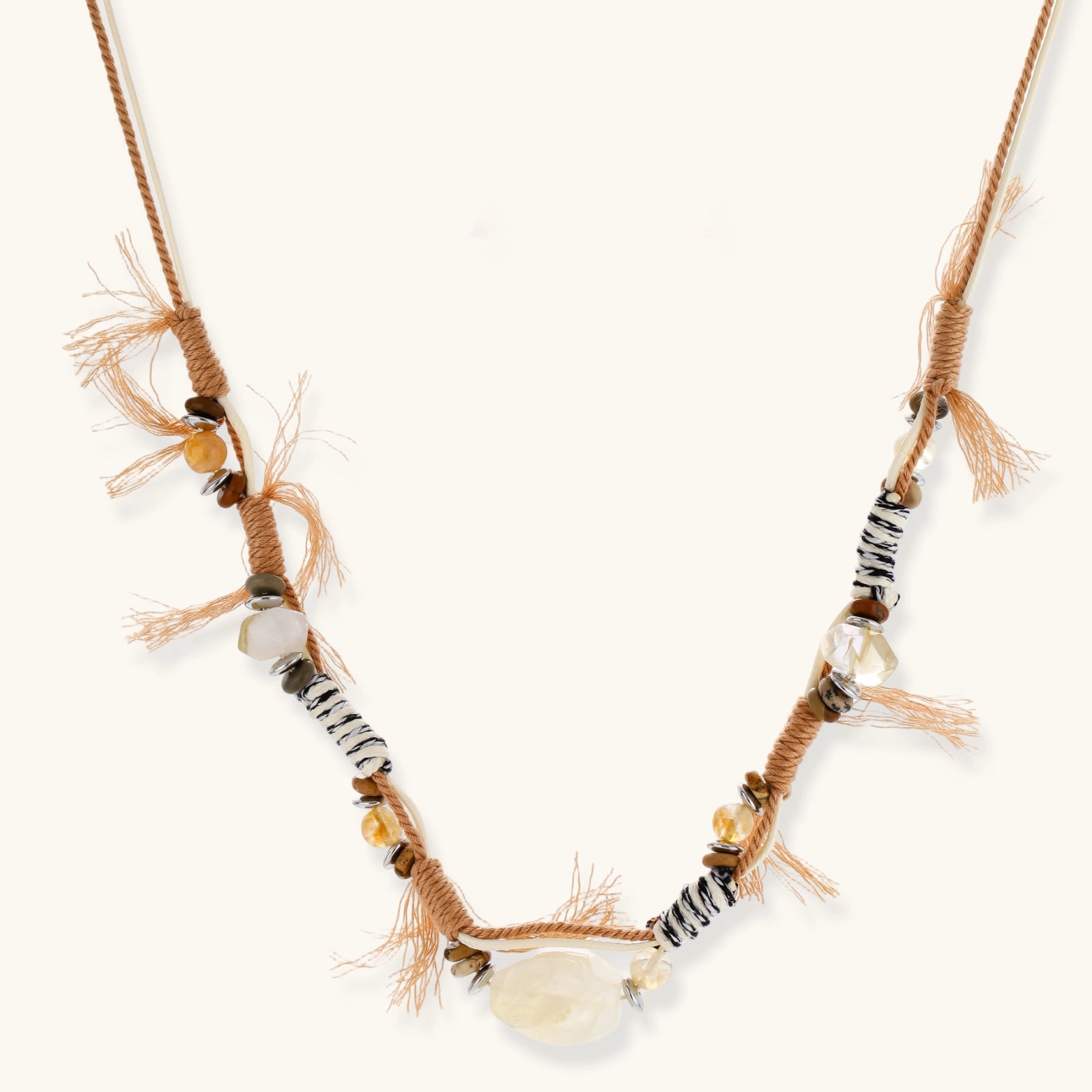 Adjustable brown cord necklace with citrine, coffee calcite beads and striped accents on white background.