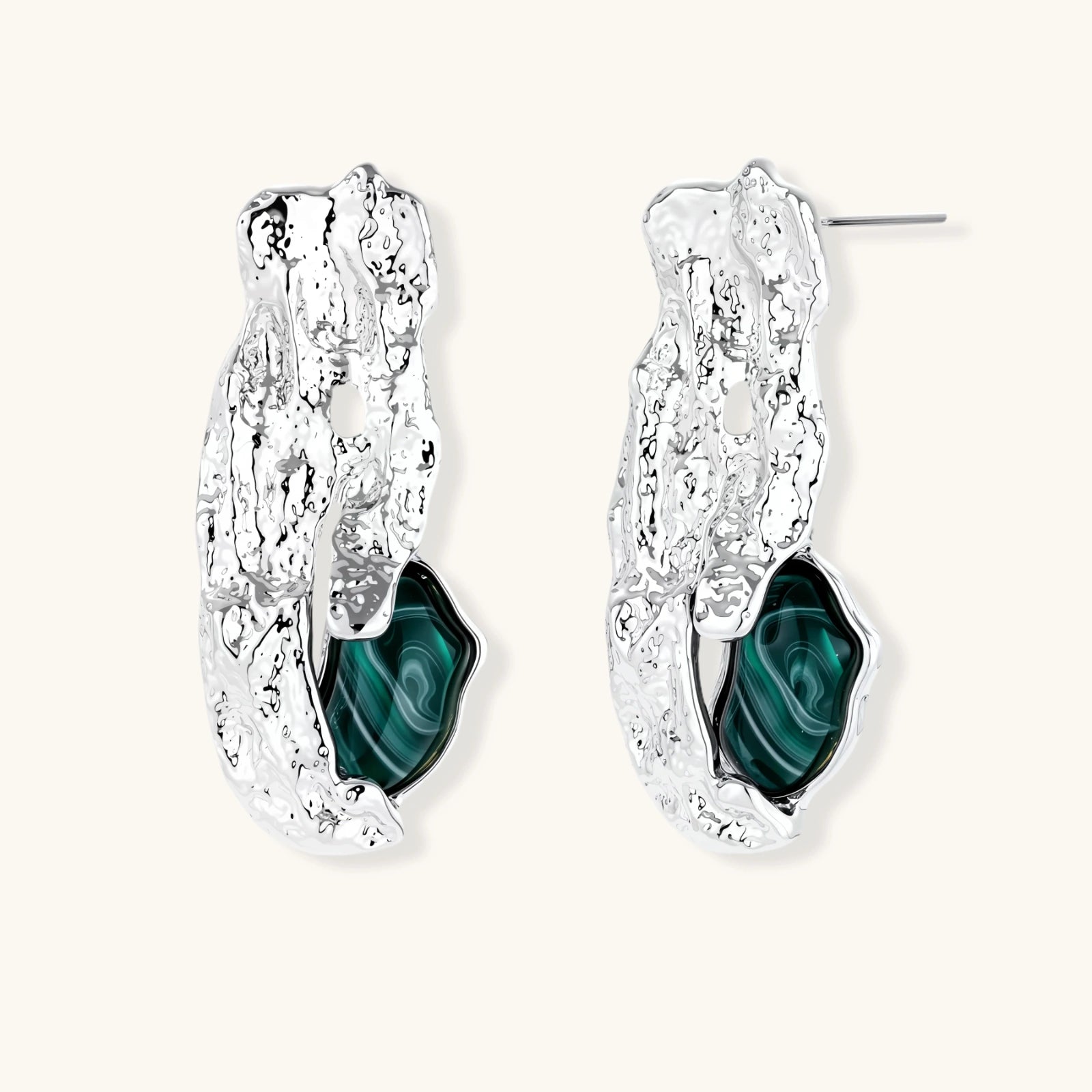 Organic-shaped stud earrings with hammered silver finish and green malachite-pattern resin stones on white background.