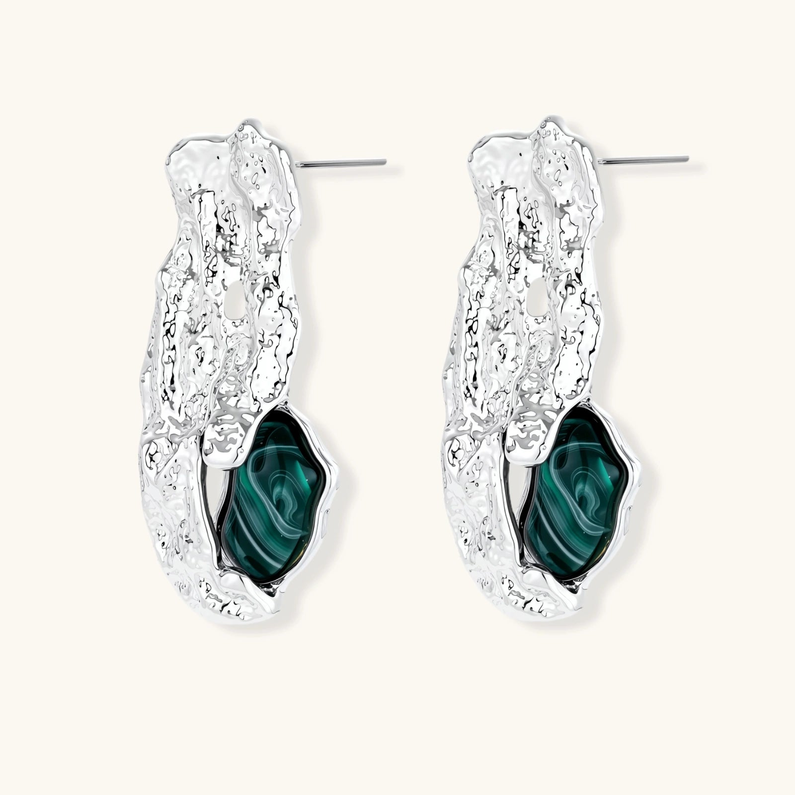 Organic-shaped stud earrings with hammered silver finish and green malachite-pattern resin stones on white background.
