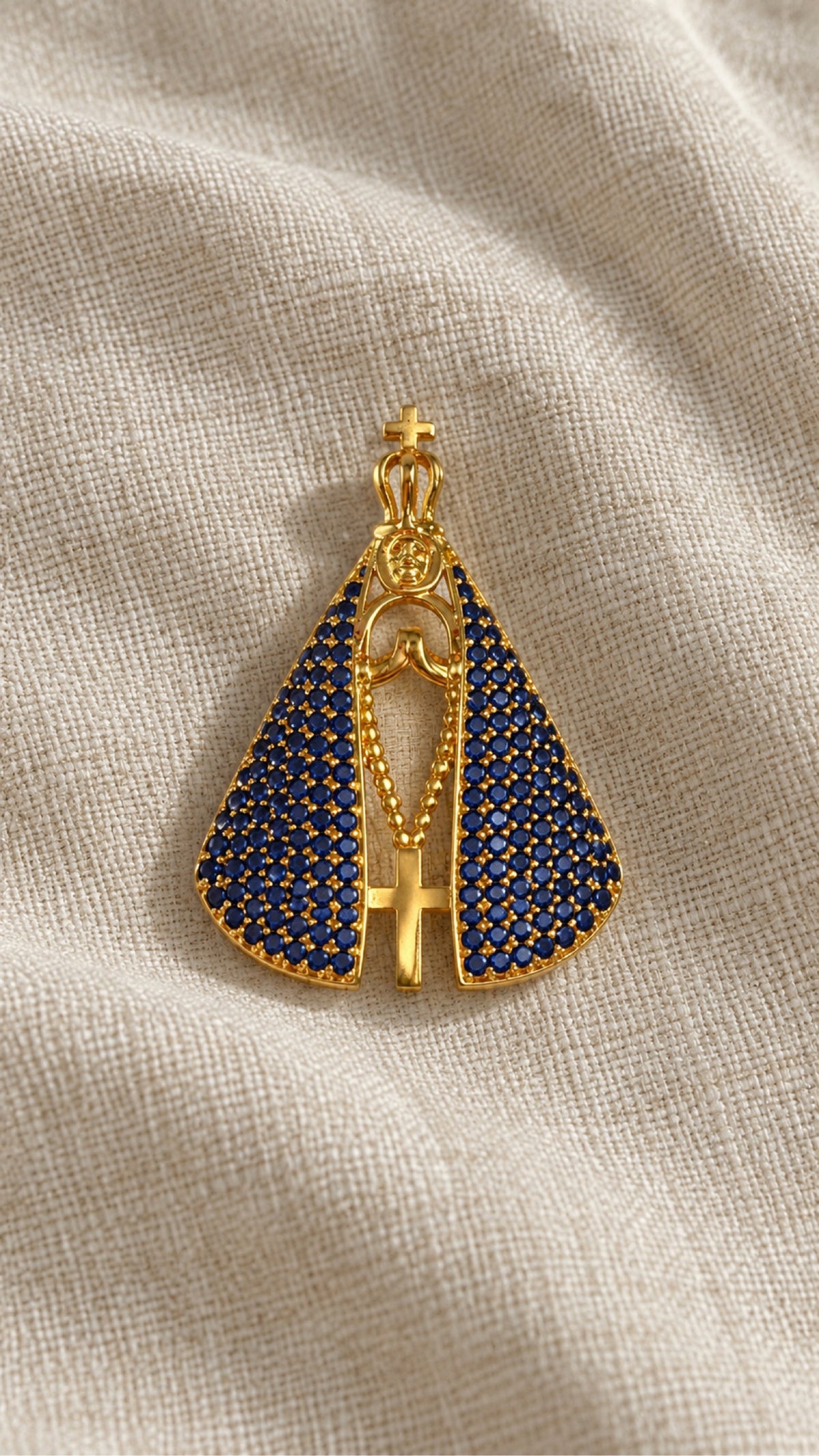 Double-faced Virgin medal, sapphire blue side, on natural linen